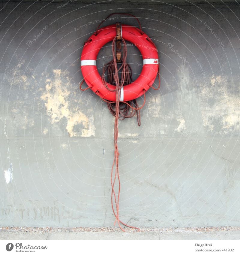 lifebelt Knot Hang Life belt Red Rope Emergency water rescue Water wings Maritime Wall (building) Symmetry Navigation Colour photo Exterior shot Copy Space left