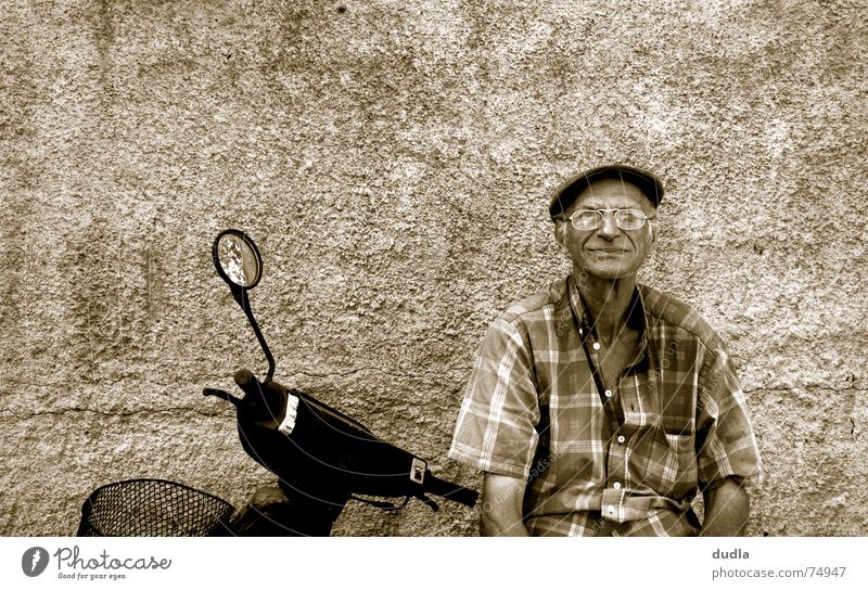 lazy greek morning Man Grandfather Greece Mediterranean Calm Goof off Serene Boredom Old Scooter Relaxation Wait Sit