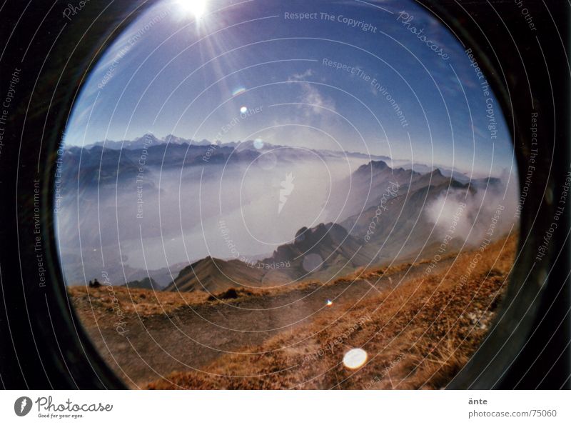 Alpine fairy tale from the fish eye Lake Steam Fog Reflection Dazzle Dry Footpath Leisure and hobbies Distorted Fisheye Lomography Sea of fog Brienzer Rothorn