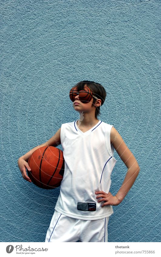 Girl with basketball under arm and eyes in basketball shape 1 Human being Wall (barrier) Wall (building) Jersey Shorts Relaxation To hold on Sports Dream Thin