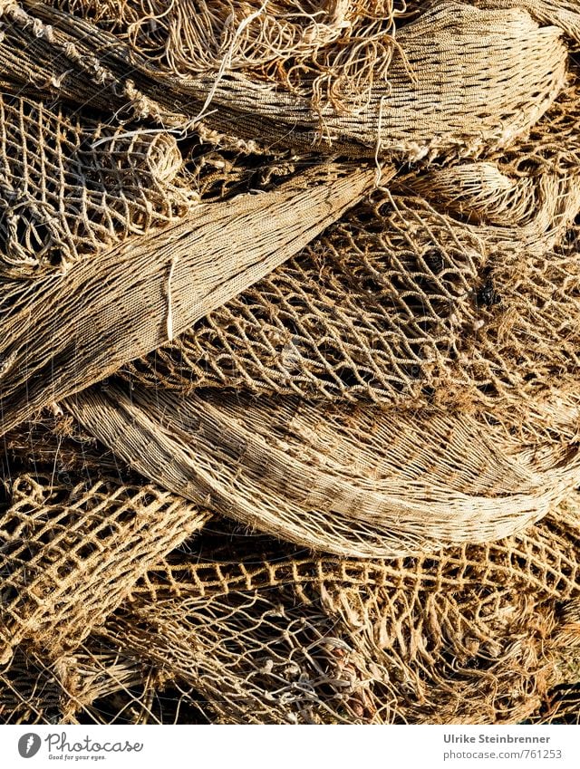 Fishnet lies to dry on plastic sheet - a Royalty Free Stock Photo