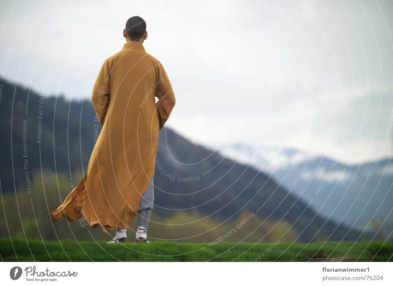 Shaolin monk in the wind Religion and faith Meditation Austria Chinese martial art Monk Wind Mountain Vantage point Nature