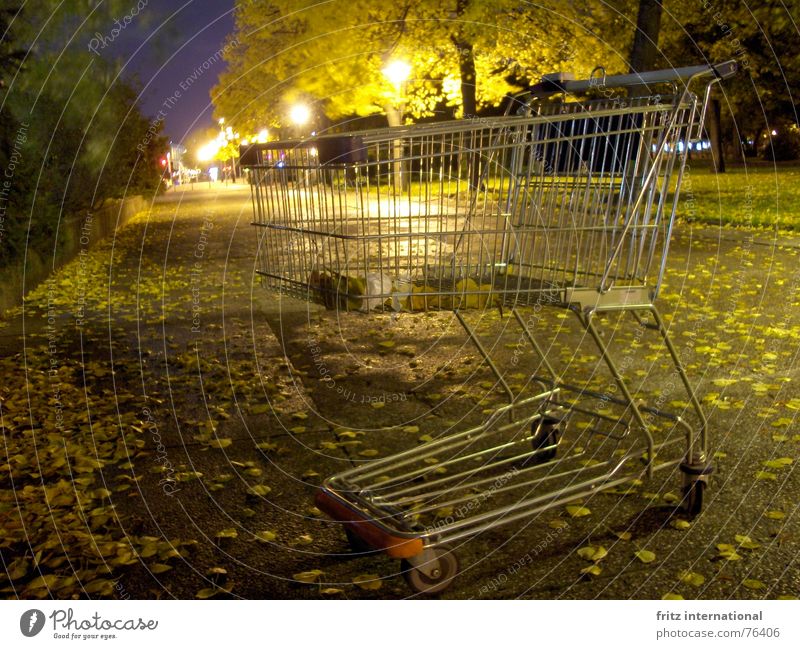 24h shopping Calm Closing time Autumn Leaf Town Deserted Shopping Trolley Gloomy Loneliness Lantern Berlin Obscure Sidewalk Street Lanes & trails Empty