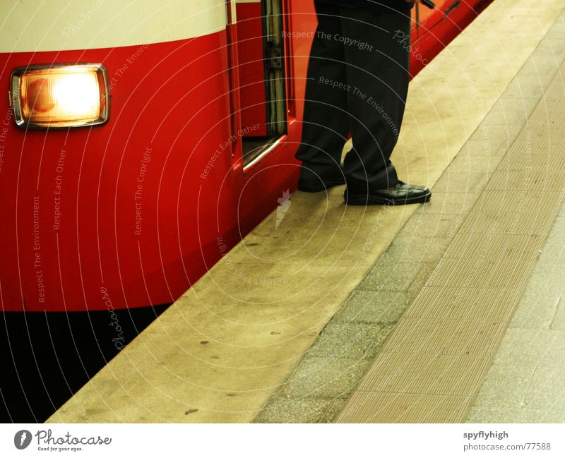 On transit Underground Uniform Footwear Red Stop Concrete Feet subway platform Floodlight Subway station