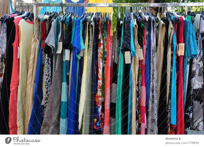 Clothing Store Rack with a Lot of Different Dresses. Stock Photo