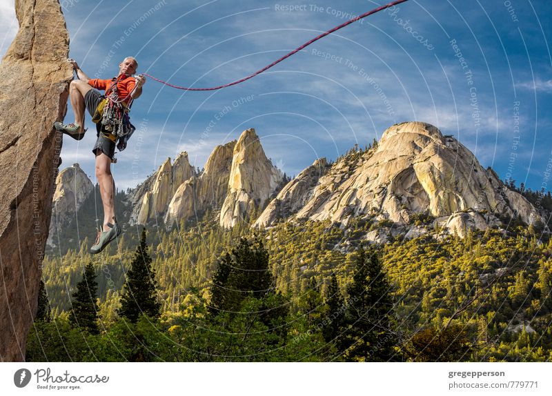 Climber tip-toes on the edge. Adventure Climbing Mountaineering Success Rope Man Adults 1 Human being 30 - 45 years Clouds Self-confident Brave Determination