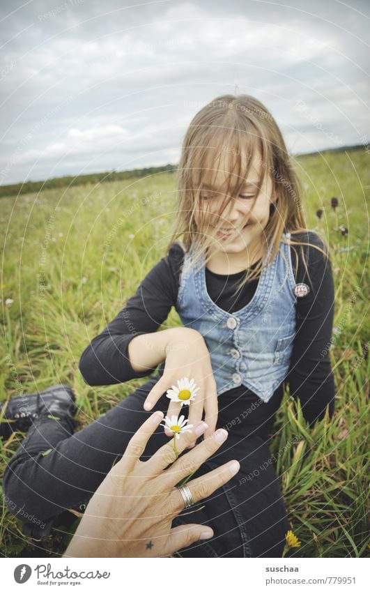 flower children . Child Girl Exterior shot Nature Relaxation Playing Leisure and hobbies Pastime Meadow Spring Sky Horizon Grass Daisy Hand Fingers