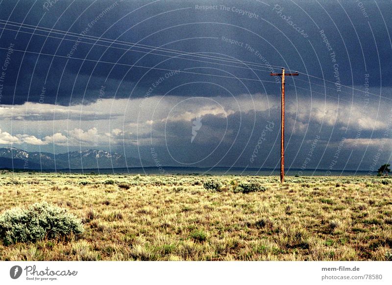 thundery mood 1 Sky Badlands Gloomy Exterior shot Clouds Sun Electricity pylon Steppe Telegraph pole Utah Dark USA Rain Americas Light Thundery shower Desert