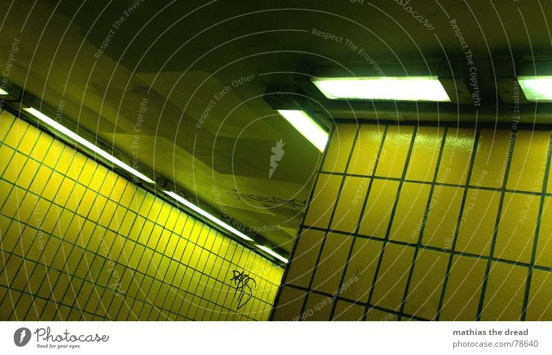 yellow shift Furrow Small sausage Pedestrian underpass Yellow Sharp-edged Wall (barrier) Wall (building) Hard Cold Physics Lamp Light Dark Loneliness