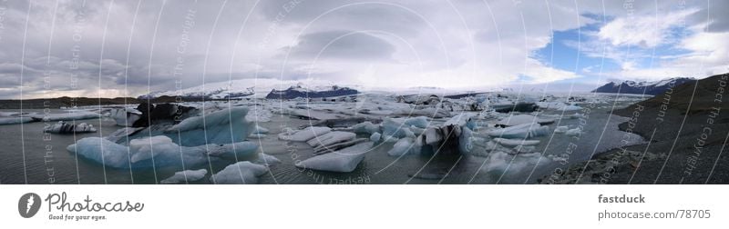 Fragments of cold Iceberg April Iceland Glacier Panorama (View) Ocean Water Snow Large Panorama (Format)