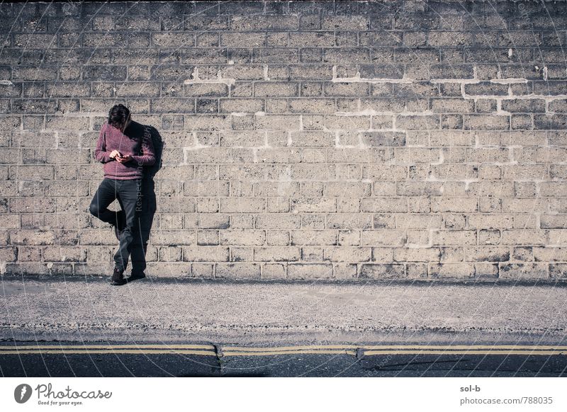 distracted Lifestyle To talk Masculine Young man Youth (Young adults) 1 Human being 18 - 30 years Adults Wall (barrier) Wall (building) Street Think Stand Wait