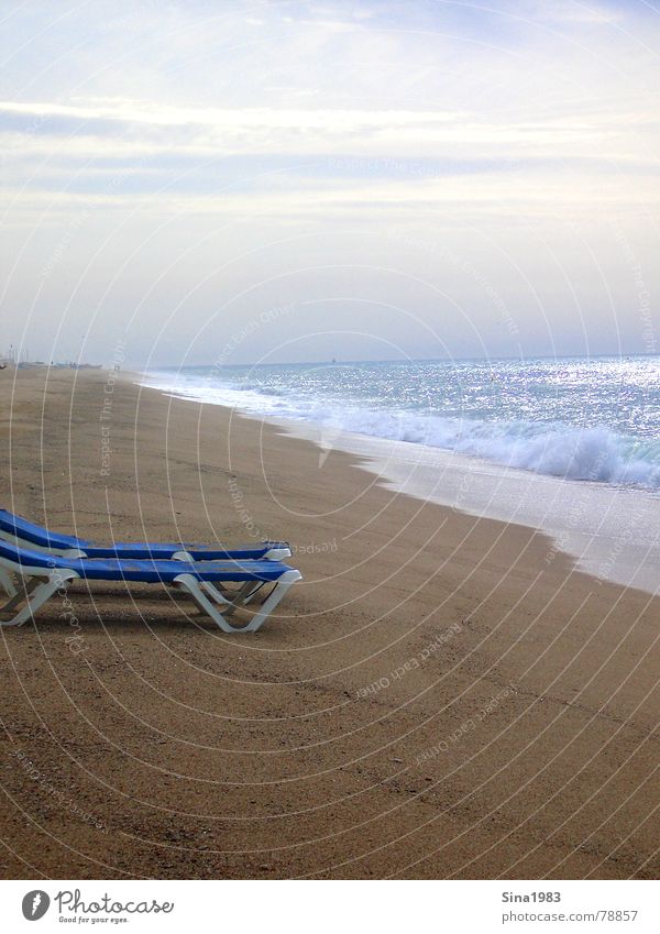 A deckchair rarely comes alone... Beach Ocean Waves Deckchair Vacation & Travel Loneliness Sunset Clouds Summer Think Spain Barcelona Barefoot Coast Sand Water