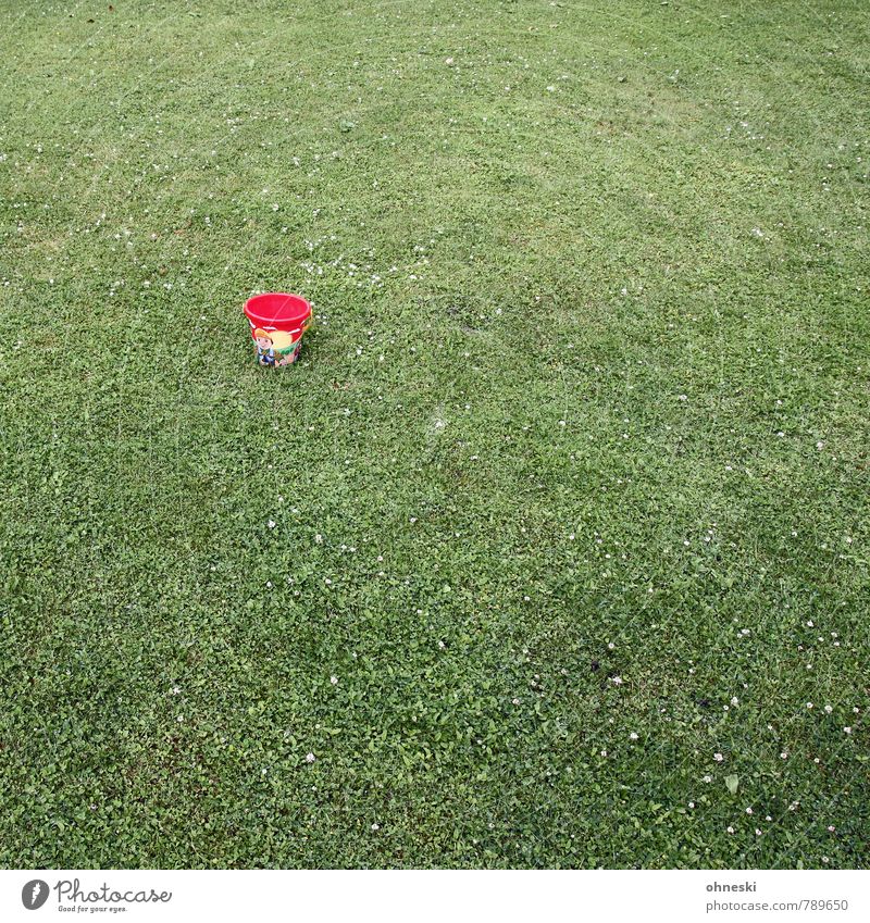 Small bucket Grass Garden Meadow Bucket Containers and vessels Toys Green Red Loneliness Infancy Colour photo Exterior shot Structures and shapes Deserted