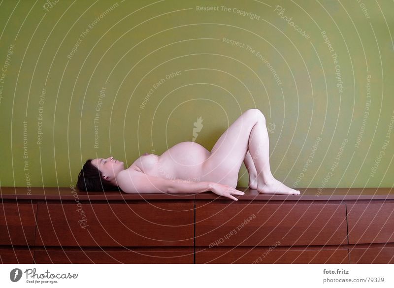Pregnant woman on chest of drawers Baby Woman Yoga Appearance Lady Healthy Fresh Beautiful Interior shot Young woman Touch Emergency Breath Lie Meditation Naked