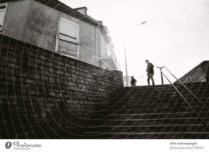 Little man, what now? Trip Human being Toddler Man Adults Life 2 Small Town House (Residential Structure) Building Stairs Facade Window Communicate Black White