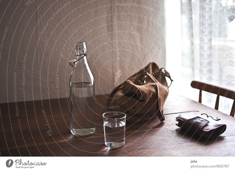 coming home Beverage Cold drink Drinking water Bottle Glass Chair Table Bag Money purse Key Esthetic Natural Safety (feeling of) Wooden table Colour photo