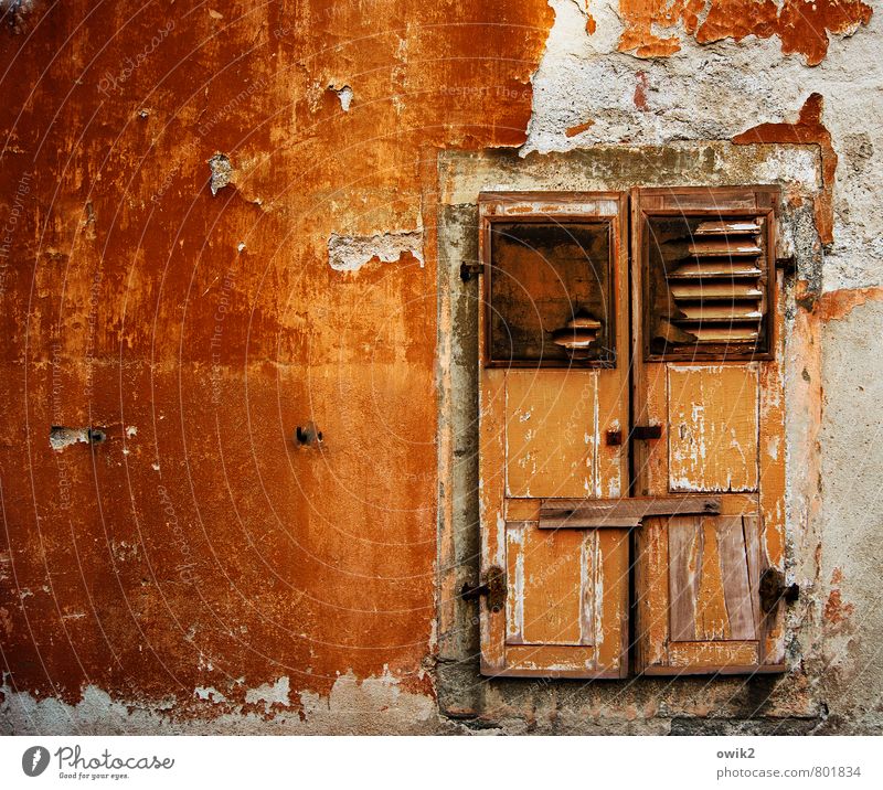 care level Deserted House (Residential Structure) Wall (barrier) Wall (building) Facade Window Shutter Closed Barricaded Illuminate Old Glittering Gloomy Orange