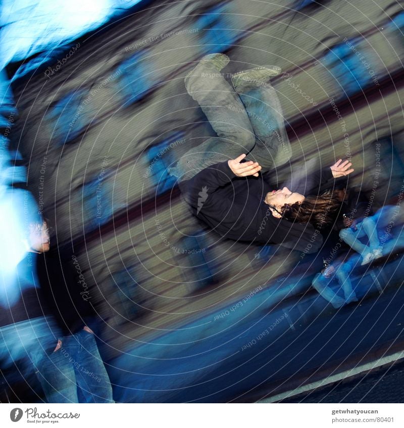 And it's turning, isn't it? Trampoline Reckless Man Salto Jump Gymnastics Leisure and hobbies Town Blur Action Flash photo Young man Human being Playing