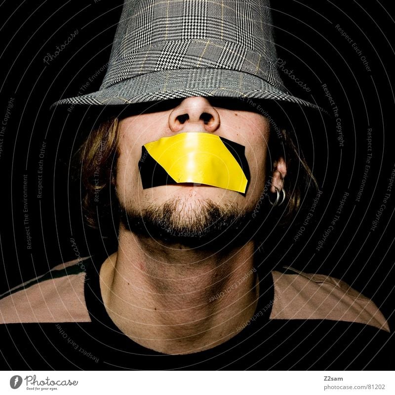 quiet please! Shackled Gagged Adhesive tape Stick Human being Stripe Facial hair Style Gray Yellow Closed eyes Man has mouth to portraite Mouth Face Hat