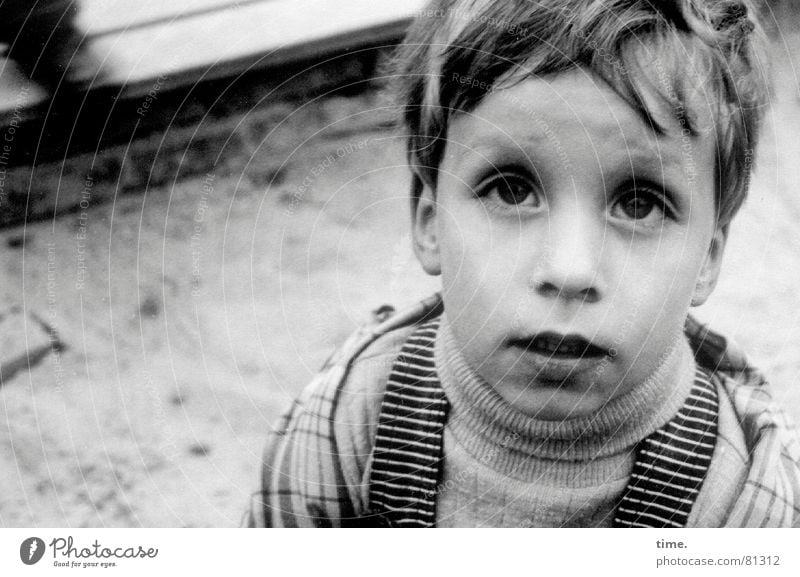 What? Playing Child Boy (child) Eyes Sand Sweater Curiosity Emotions Loneliness Disbelief Sandpit Anorak Mop of curls fuzzy Ask Portrait photograph Looking