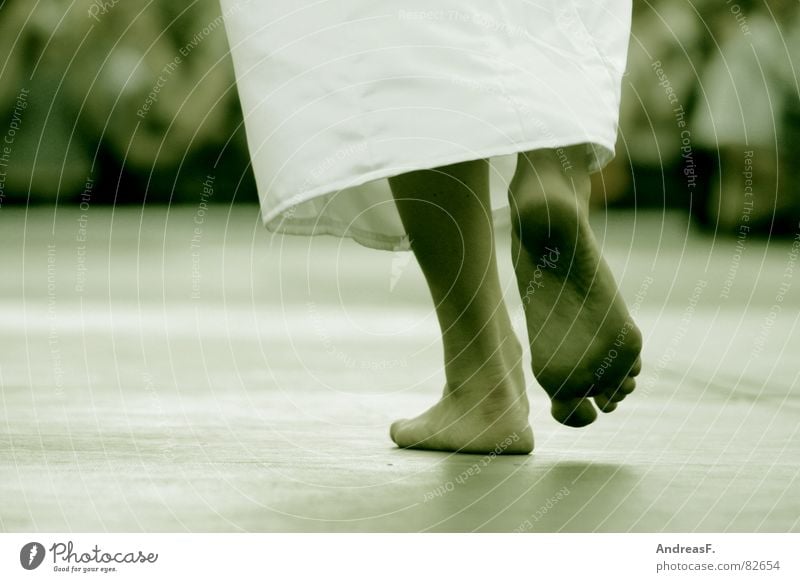 Girl with dirty bere feet soles arter walking Stock Photo