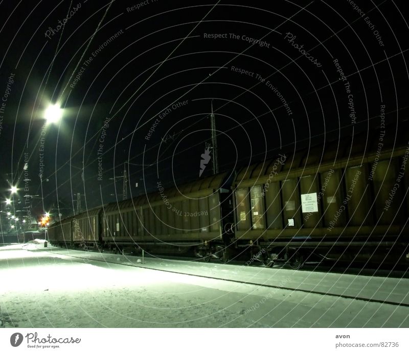 Lonely cargo Railroad Railroad tracks Night Station Train station express train special train Snow wagon containers Cable