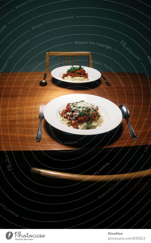 Two Bolognese, one without cheese! Spaghetti Basil Noodles Dinner table Chair Cheese Parmesan Italian Food Crockery Plate Cutlery Fork Spoon Wood Eating