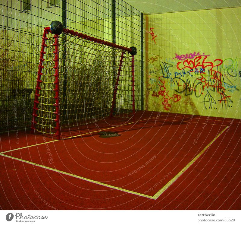Playground {m} = playground Corner Tartan Vacuum Generation gap Soccer Goal Penalty area Wall (building) Night Playing Ball sports Soccer team Death Empty Red