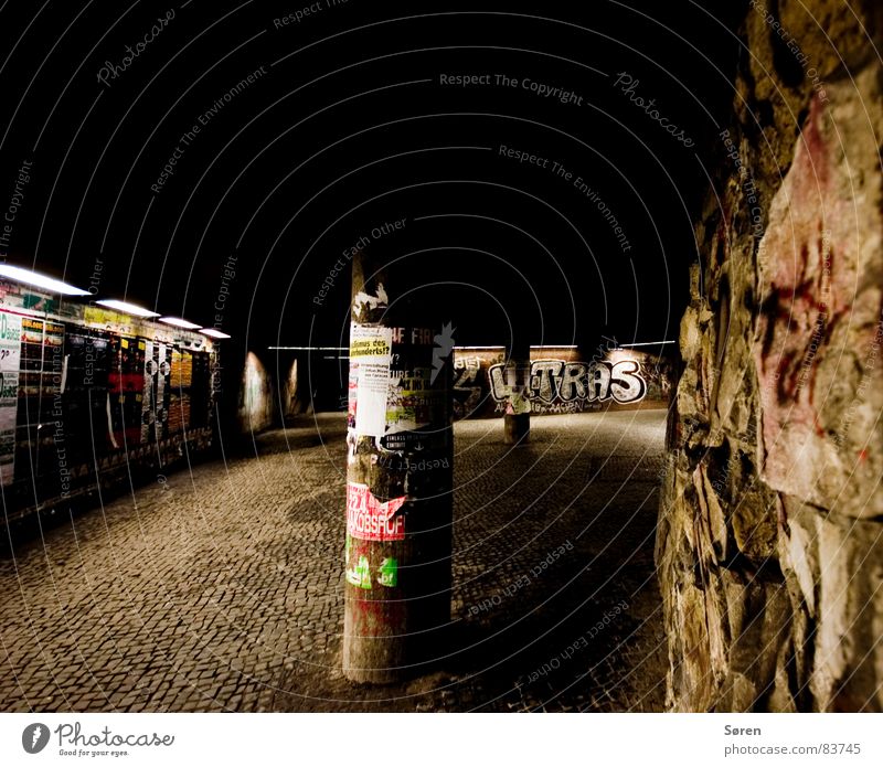 ghetto Placard Aachen Advertising column Wall (building) Neon light Dark Wall (barrier) Poster Night Wide angle Loneliness Tunnel Ghetto Town Harmful Tramp
