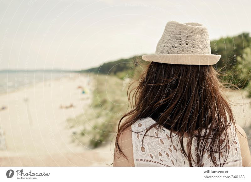 Girl from behind with hat in front of beach panorama Wellness Harmonious Well-being Swimming & Bathing Vacation & Travel Tourism Trip Freedom Summer