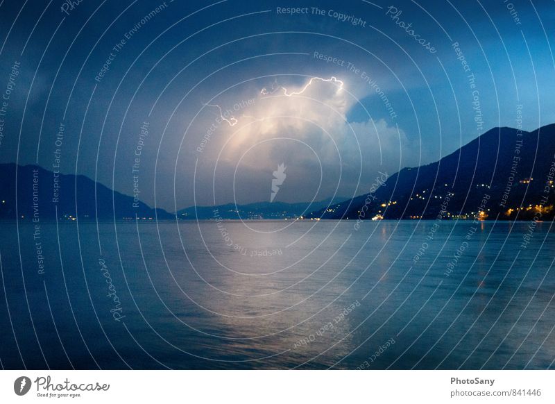 The moment. Sky Storm clouds Night sky Thunder and lightning Lightning Hill Lake Threat Dark Blue Black Lago Maggiore Colour photo Exterior shot