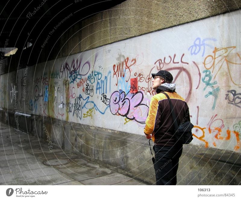 IN THE STREETS Fellow Cap Town Street art Dresden Wall (barrier) Light Baseball cap Quarter Townsfolk Tunnel Man Graffiti Human being Underpass Guy Daub