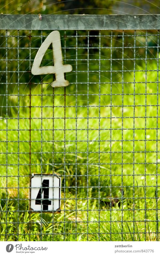 44 Berlin Garden Garden plot Garden allotments Town Suburb Digits and numbers House number Fence Wire netting fence Neighbor Border In pairs Grass Meadow Green