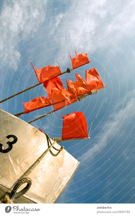 Red flags on fishing boat - a Royalty Free Stock Photo from Photocase