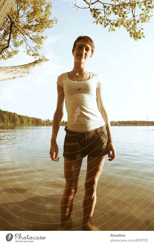 The water's warm! Trip Adventure Summer Young woman Youth (Young adults) Body 18 - 30 years Adults Landscape Lakeside T-shirt Summer dress Brunette Long-haired