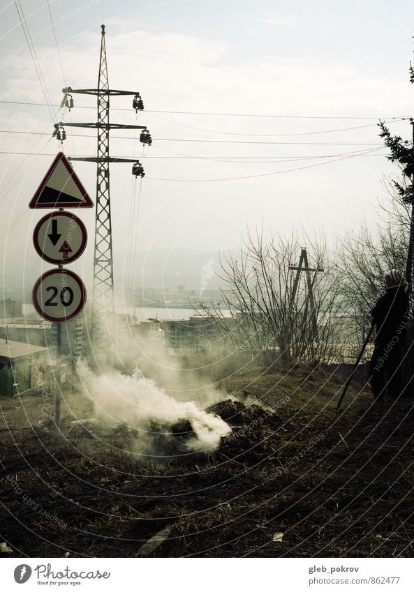 Doc #symbols Human being Life 1 30 - 45 years Adults Russia Small Town Downtown Old town Antenna Looking Crisis Smoke Fire Autumn Grass Road sign Colour photo