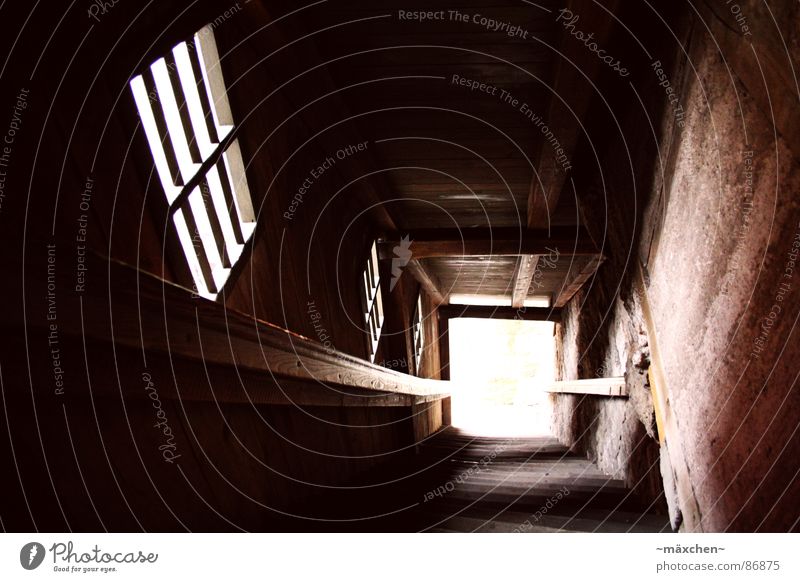 downstairs Dark Window Light Rothenburg Foreign Dangerous Sudden fall Wood Historic Germany Landmark Monument Stairs Handrail City wall Bright Anonymous
