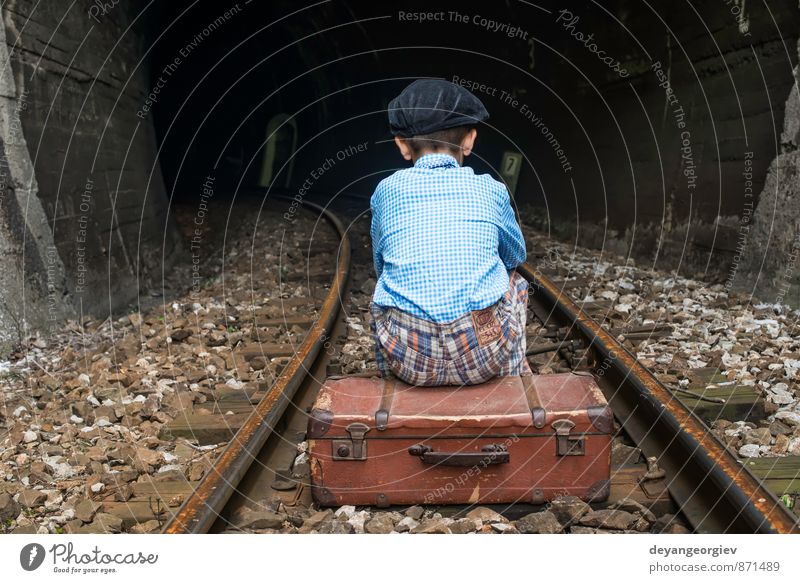 Child in vintage clothes sits on railway road Vacation & Travel Trip Human being Girl Boy (child) Infancy Nature Transport Railroad Suitcase To fall Sit Sadness