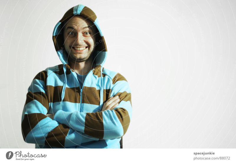 sitting and smiling Portrait photograph Crazy Freak Interlock Psychotic Young man Joy Hooded (clothing) Laughter Grinning Sit Chair Arm hoodie go crazy Bizarre