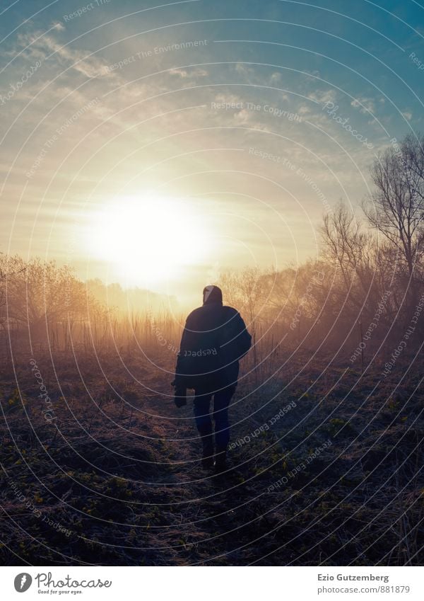  Man  standing  at sunset in nature  a Royalty Free Stock 