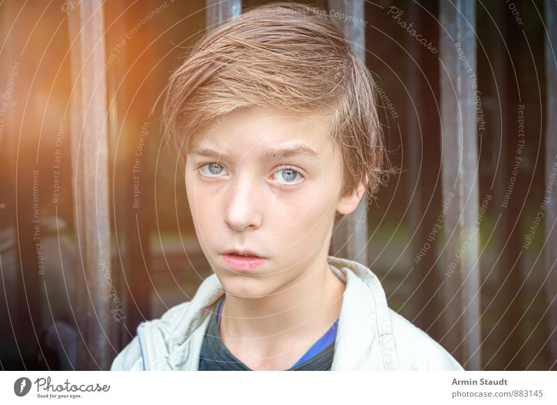 Portrait in front of bars Lifestyle Human being Masculine Youth (Young adults) Head 1 13 - 18 years Child Door Grating Window pane Brunette Glass Authentic