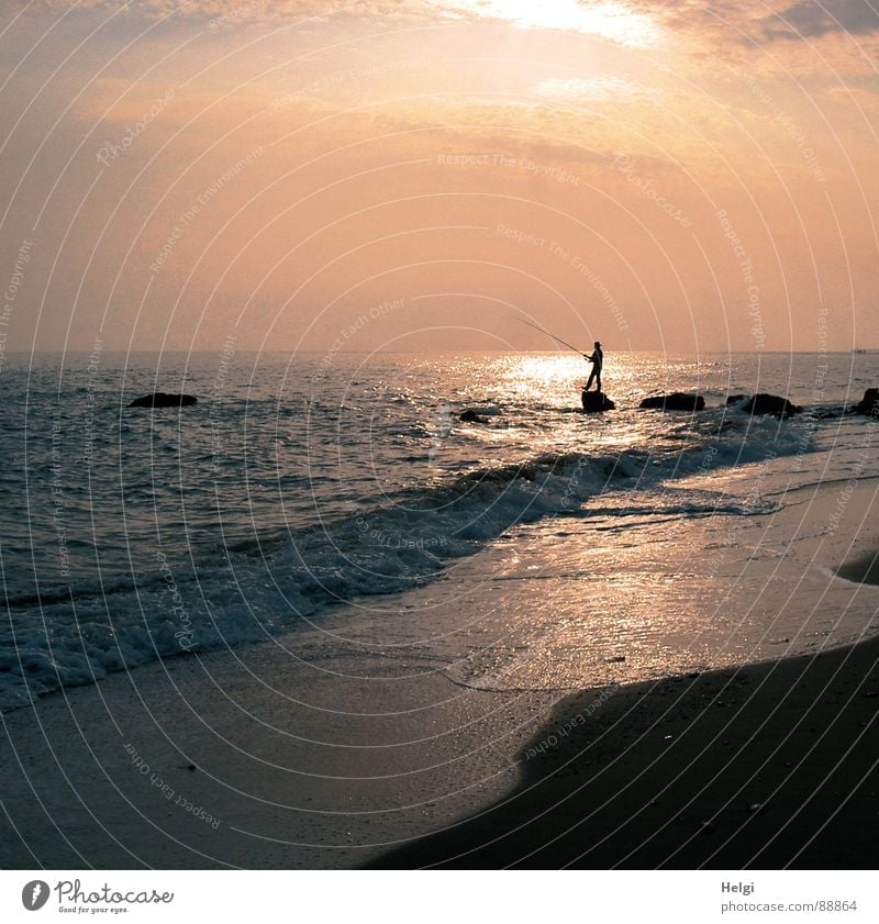 Silhouette of an angler on the beach in the evening sun Joy Relaxation Leisure and hobbies Fishing (Angle) Vacation & Travel Summer Sun Beach Ocean Waves