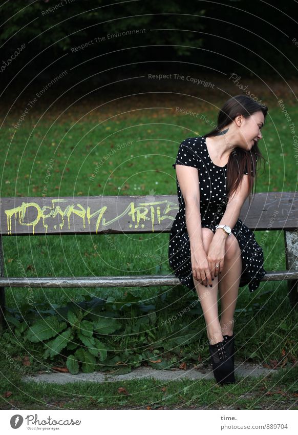 . Feminine Young woman Youth (Young adults) 1 Human being 18 - 30 years Adults Park Meadow Park bench Dress High heels Brunette Long-haired Graffiti Laughter