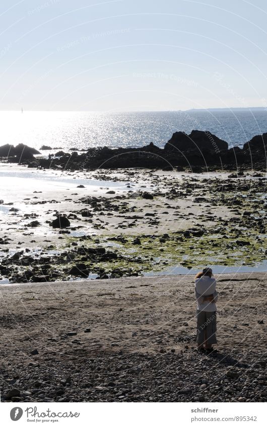 Embrace width Human being Couple Partner 2 Nature Landscape Cloudless sky Beautiful weather Rock Coast Beach Bay North Sea Ocean Emotions Moody