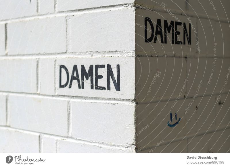DaMen? Feminine House (Residential Structure) Wall (barrier) Wall (building) Facade Stone Sign Characters Signs and labeling Gray Black White Lady Toilet Gender