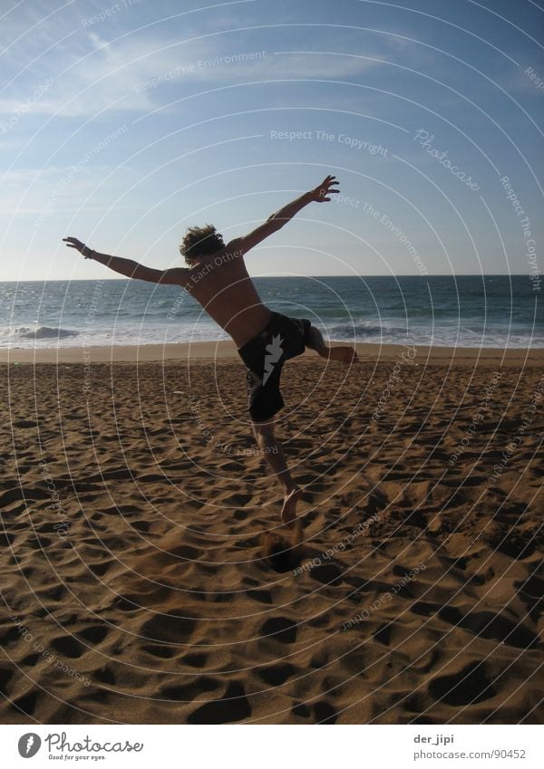 Time for Nothing Beach Vacation & Travel Ocean Waves Fellow Man Jump Coast Morocco Back-light Snapshot Physics Hot Exterior shot Joy Summer Happy Sand Shadow