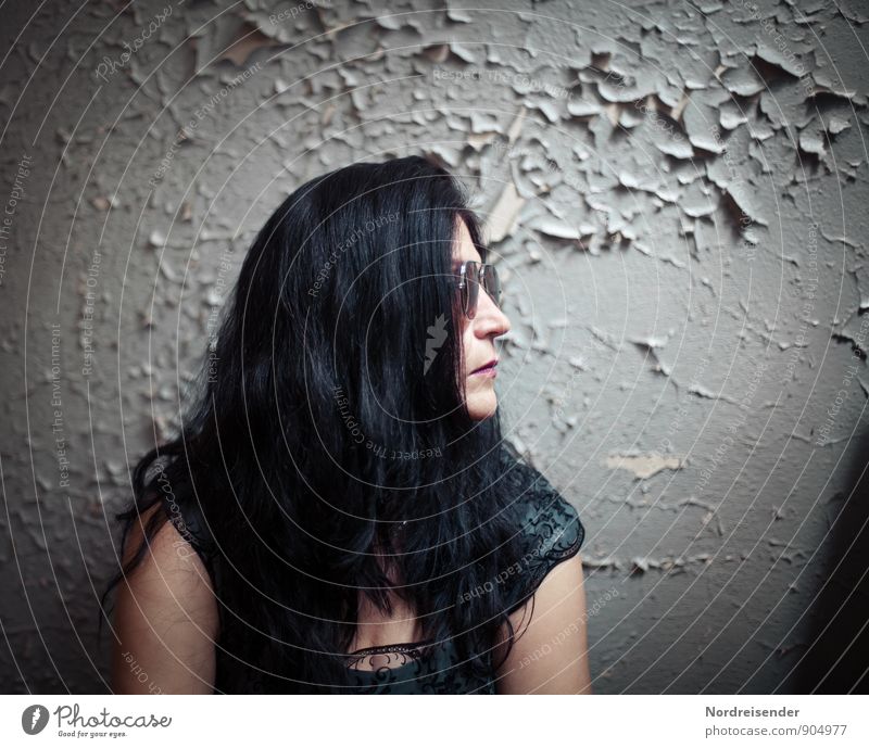Woman with long black hair in retro look in front of an old wall Lifestyle Style Human being Feminine Adults 1 Wall (barrier) Wall (building) Fashion