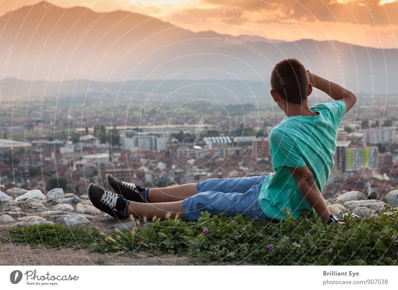 Sitting boy looking down at the city Lifestyle Harmonious Contentment Summer Summer vacation Hiking Masculine Boy (child) 1 Human being 8 - 13 years Child