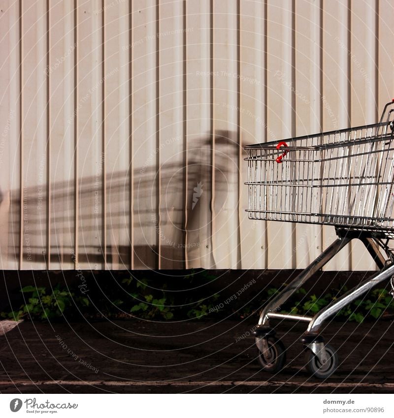 shadow Grating Aluminium Easy Tin Wall (building) White Yellow Dark Night Long exposure Würzburg Grass Lettering Bulge Destruction shopping cart Old Coil Wheel