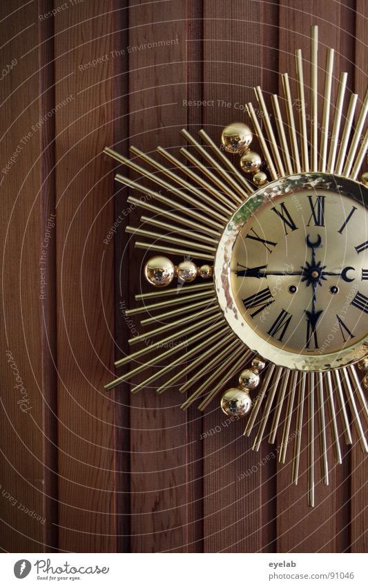 Exif-Time with a difference Clock Wall clock Wall (building) Wooden wall Wall panelling Seventies Digits and numbers Roman numerals Gold Kitsch Jewellery Legacy